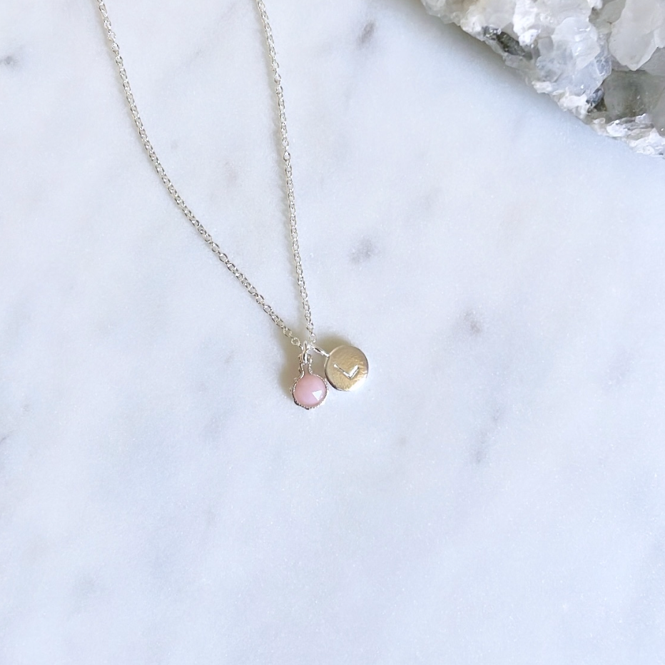 Personalised birthstone jewellery with sterling silver pink opal pendant on a silver cable chain and initial pendant