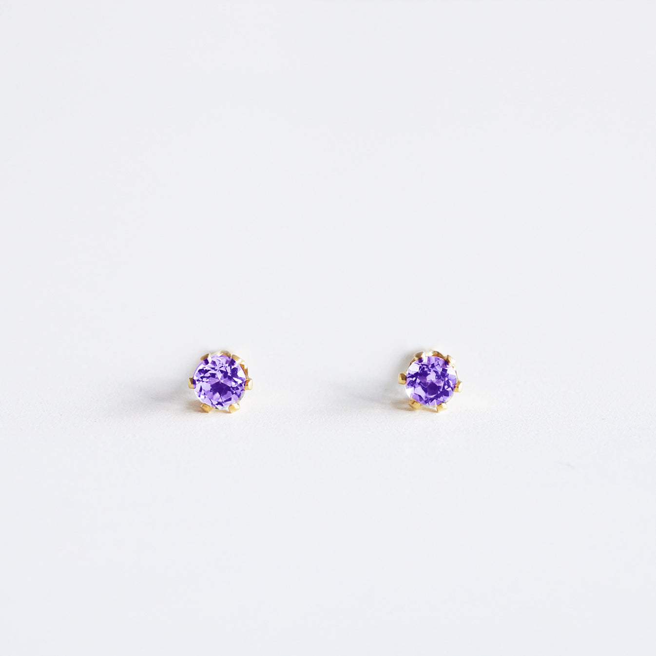 dainty amethyst studs in gold filled with round gemstones