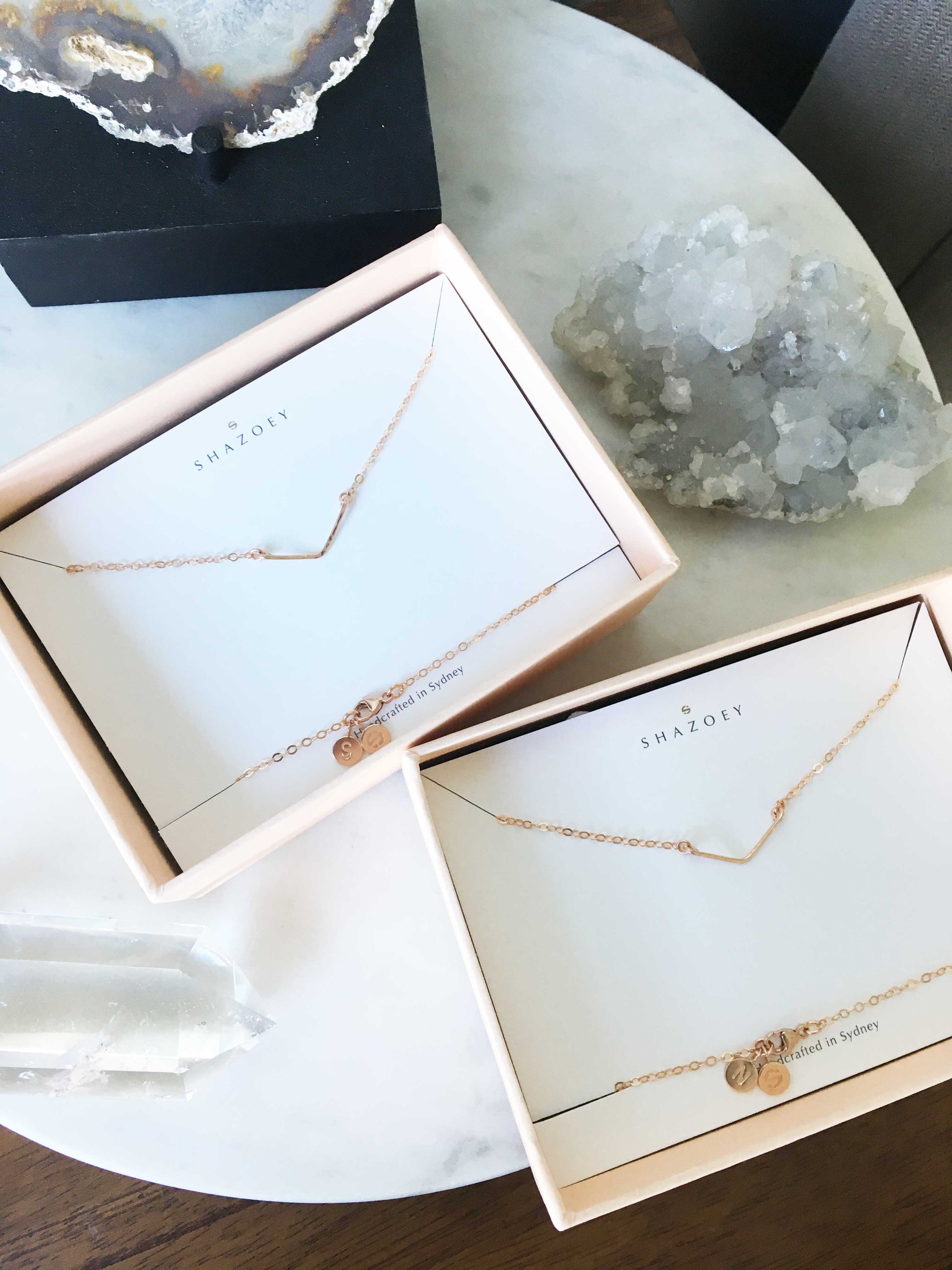 Minimalist 14k rose gold chevron pendant necklaces in pink gift boxes