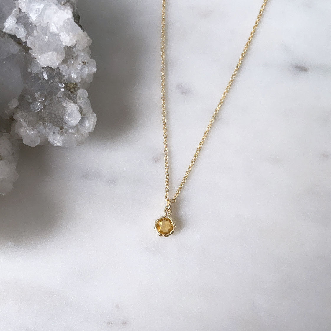 A dainty rose cut citrine gemstone pendant necklace on a fine gold chain handmade in Australia