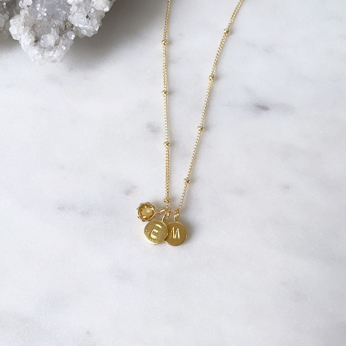 Gold minimalist citrine November birthstone necklace with personalised initial pendants and a gold satellite chain