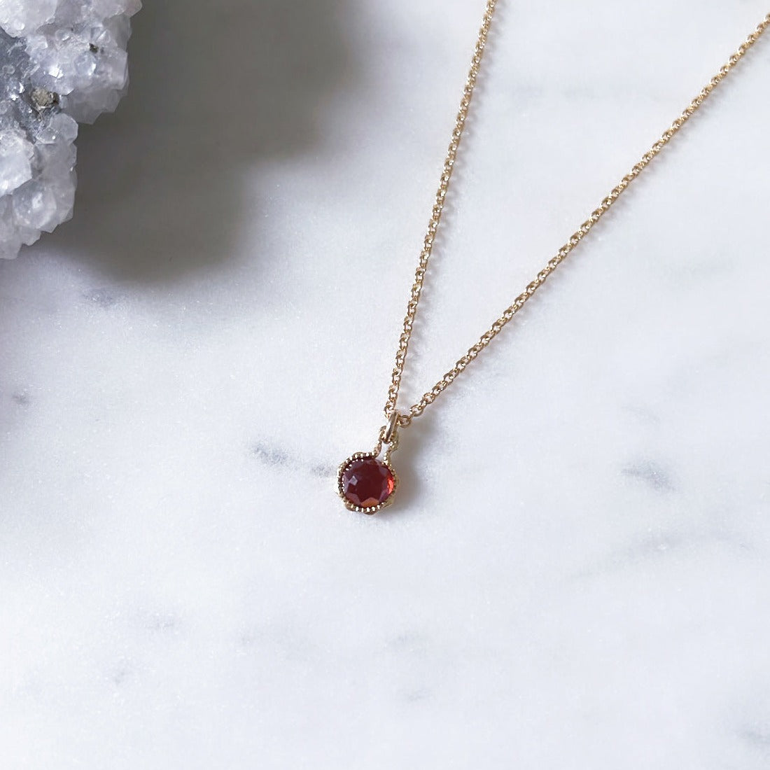 January birthstone necklace with a red garnet pendant in 14k gold filled