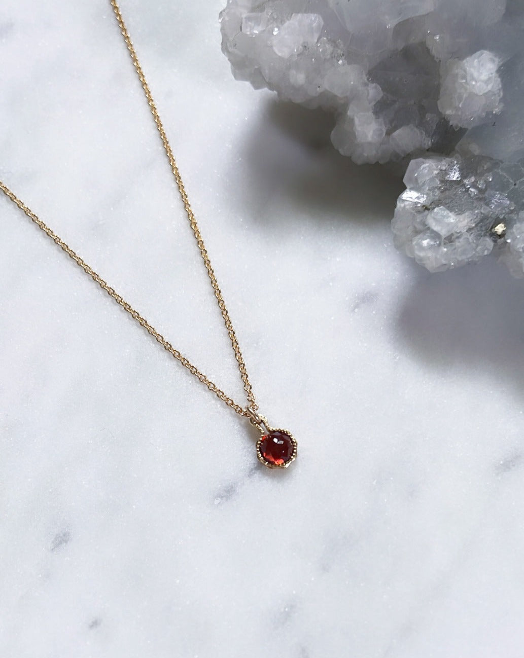 Sparkly red garnet January birthstone necklace in gold