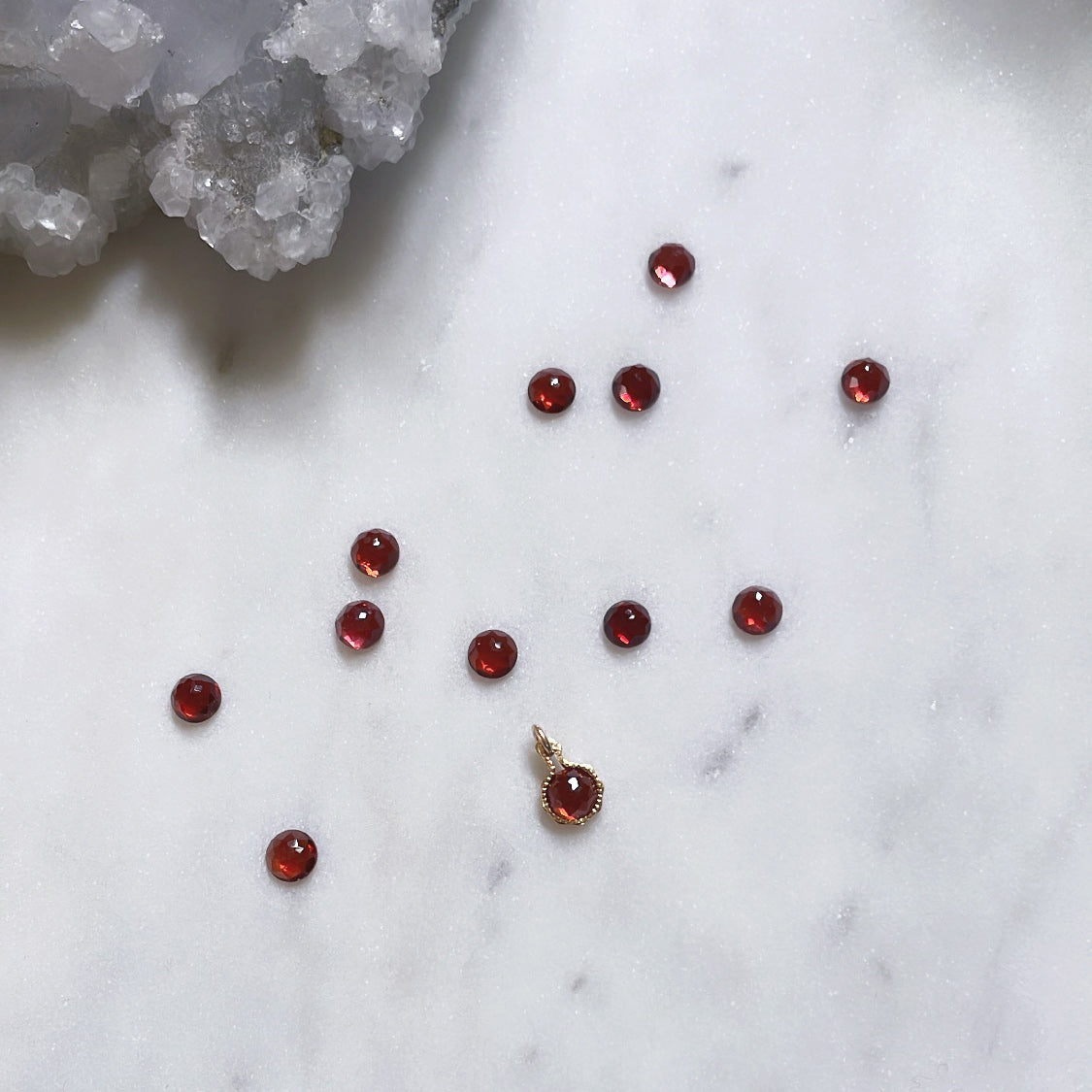 Red garnet pendant in 14k gold filled surrounded by red garnet gemstones January birthstone