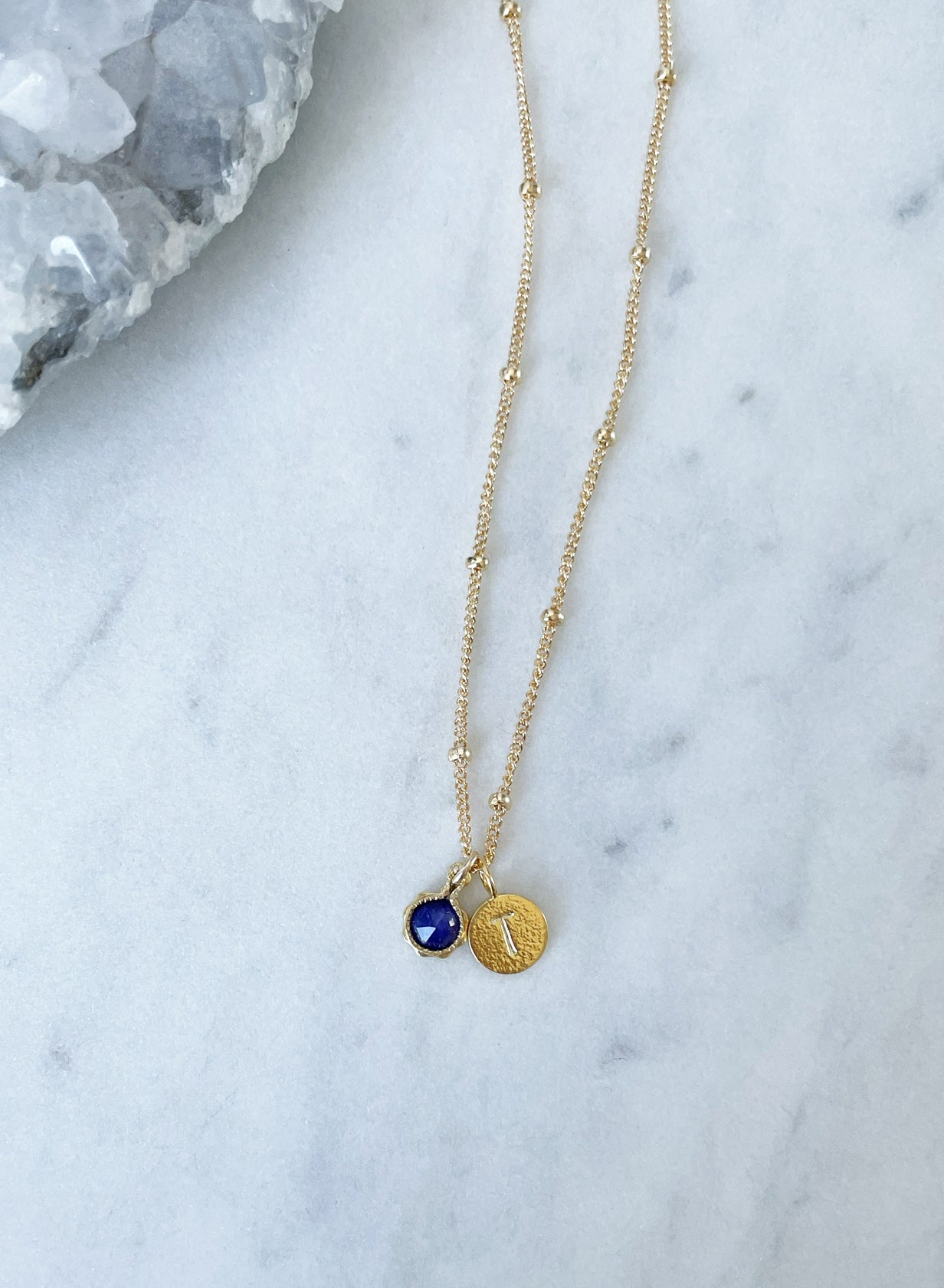 Blue sapphire necklace with letter initial pendant in gold