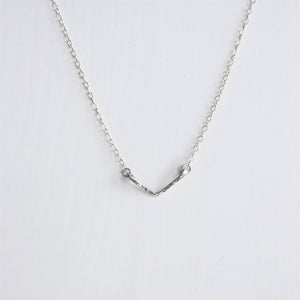 A hand hammered  dainty sterling silver chevron V necklace