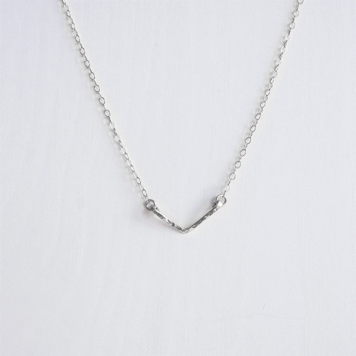 A hand hammered  dainty sterling silver chevron V necklace