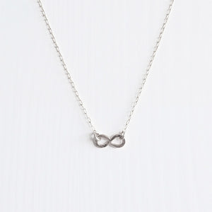 A delicate handmade sterling silver infinity necklace