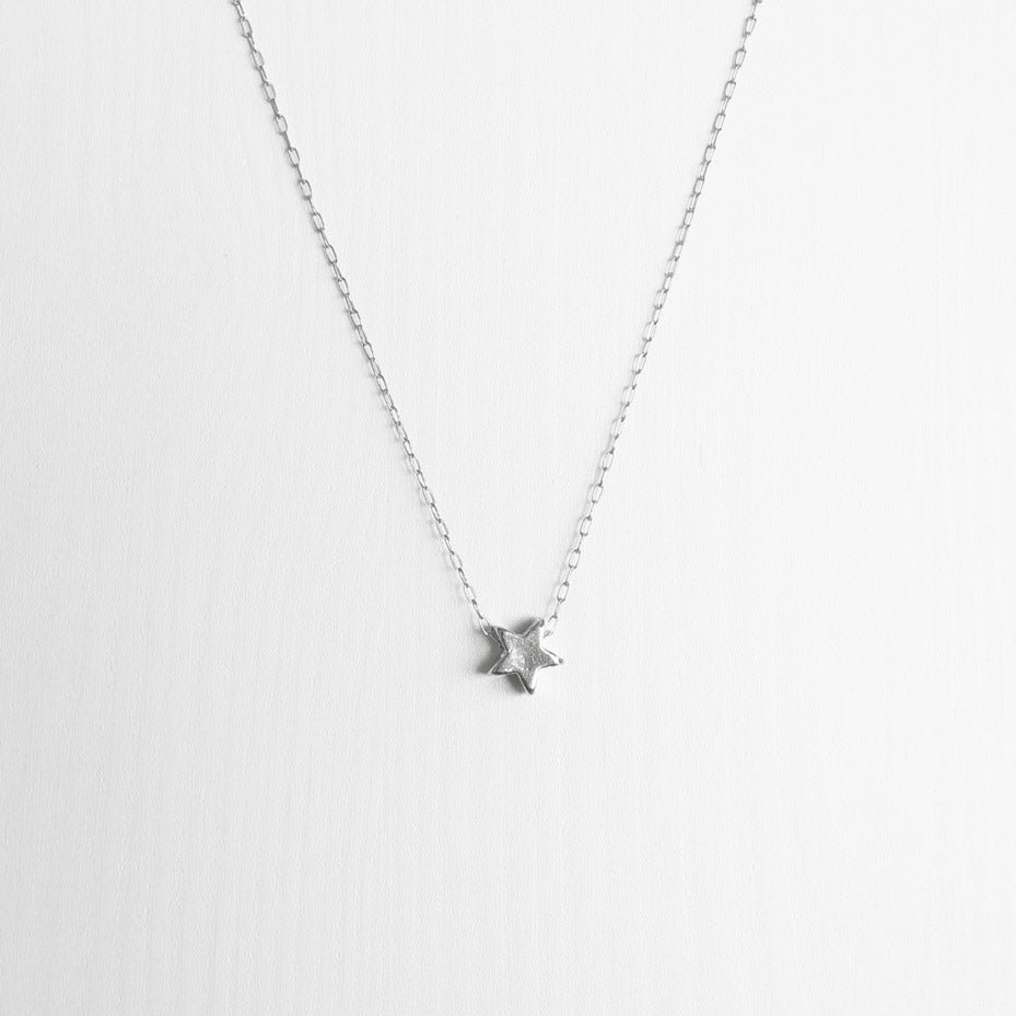 Tiny sterling silver star necklace on a delicate silver chain handmade in Australia