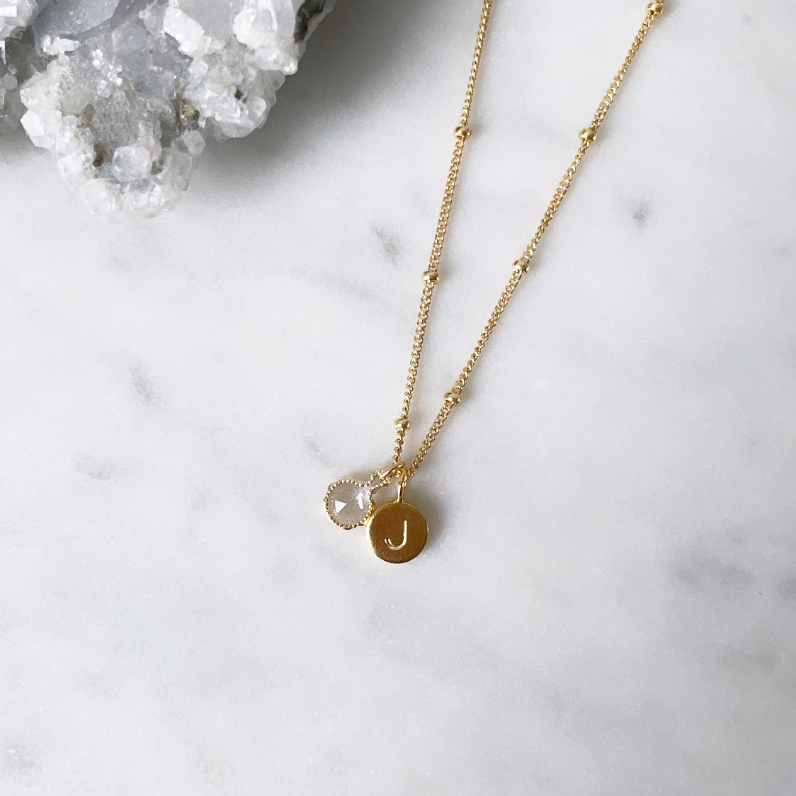 Birthstone necklace with genuine gemstone pendant and a personalised initial charm in 14k gold filled