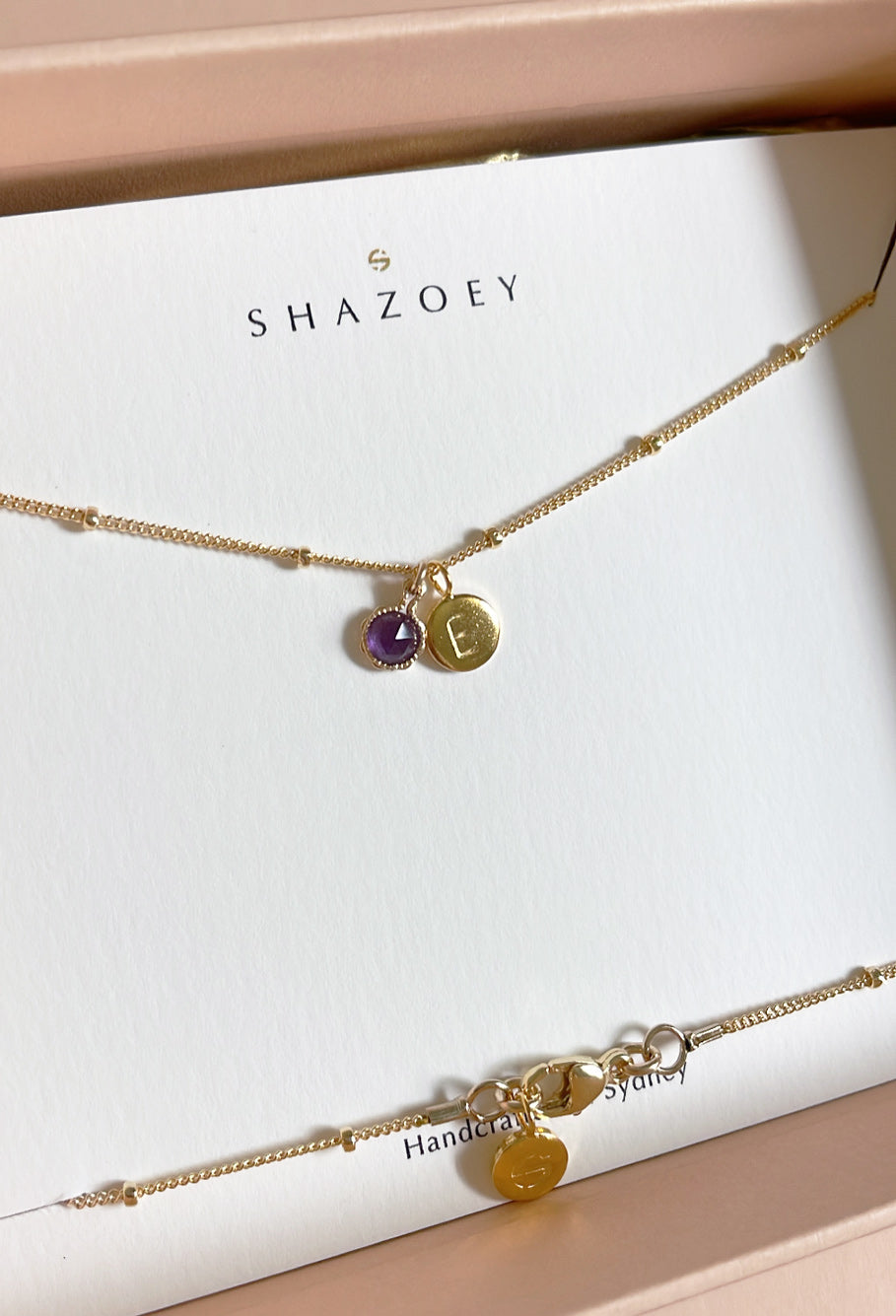 February birthstone necklace with a rose cut purple amethyst pendant on a gold beaded necklace chain