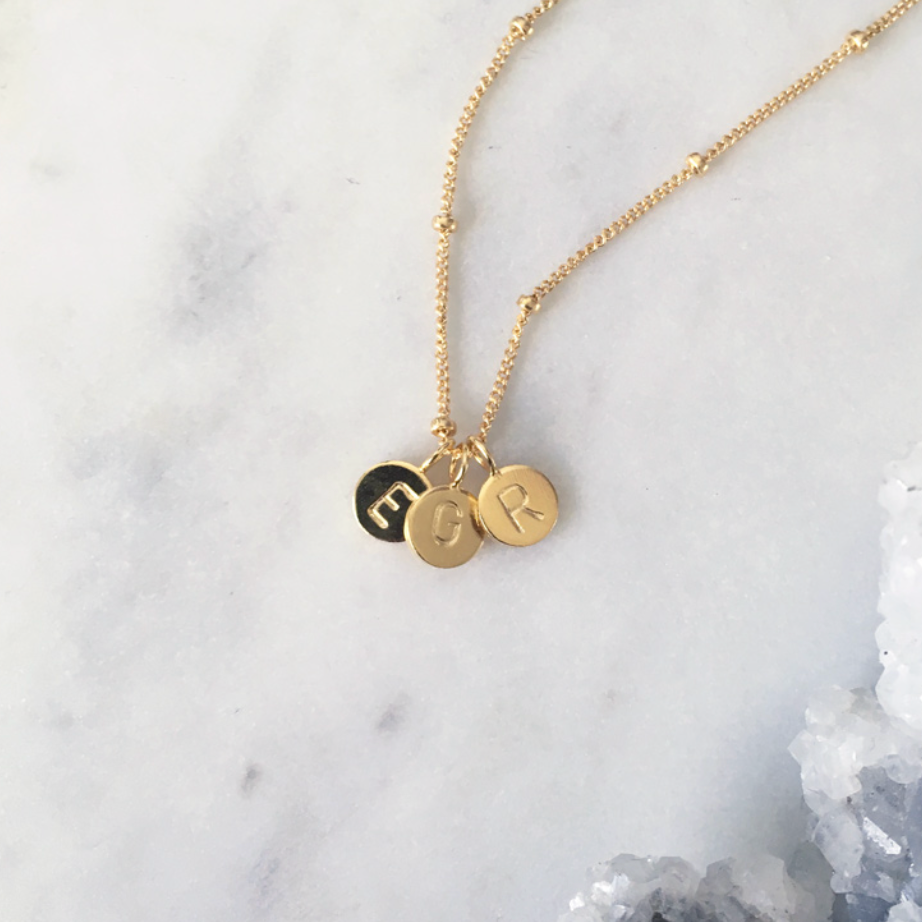 Minimalist gold letter necklace with stamped initial pendants. Handmade Australian custom jewellery