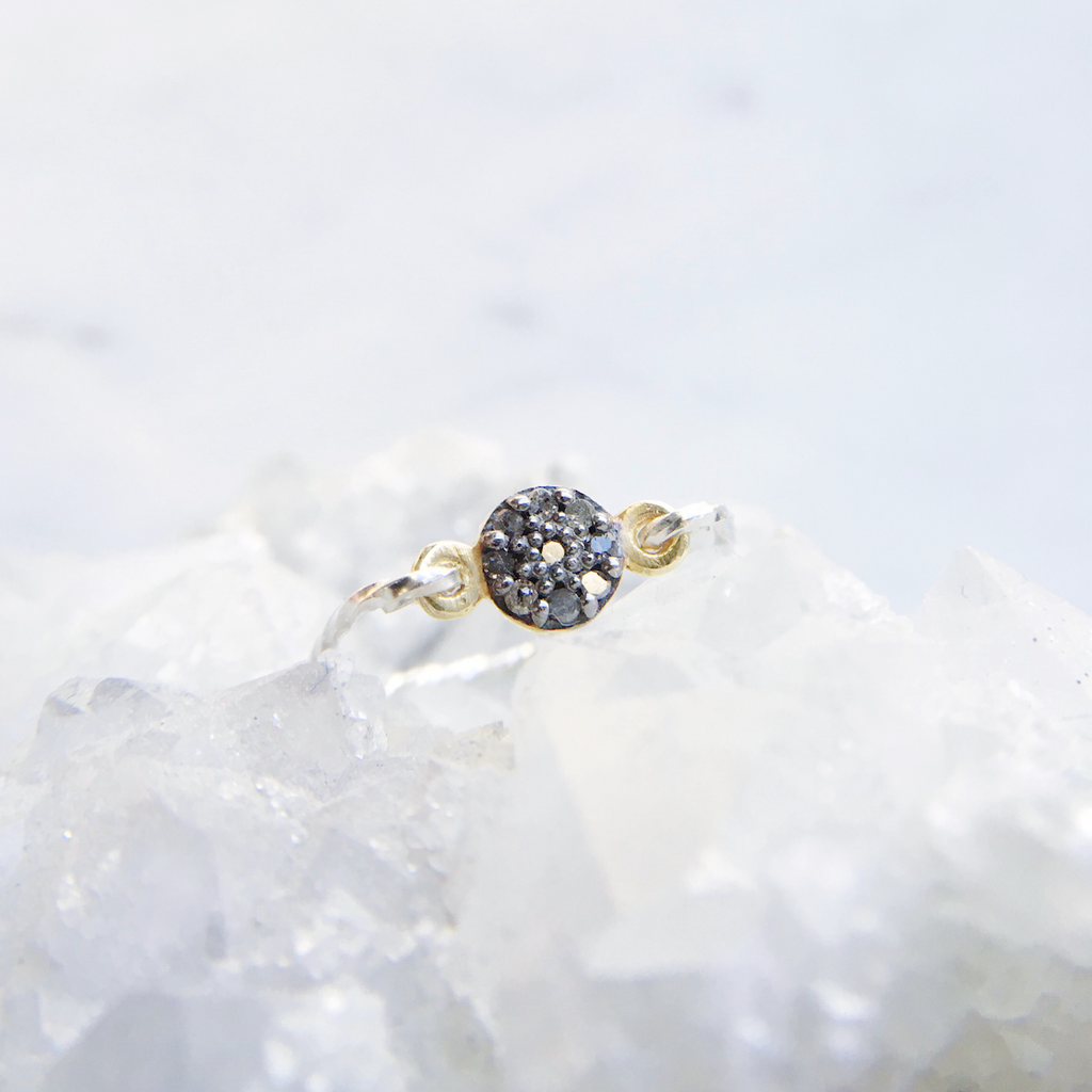 Modern diamond ring with small pavé rough diamonds on a twisted sterling silver band handmade in Australia