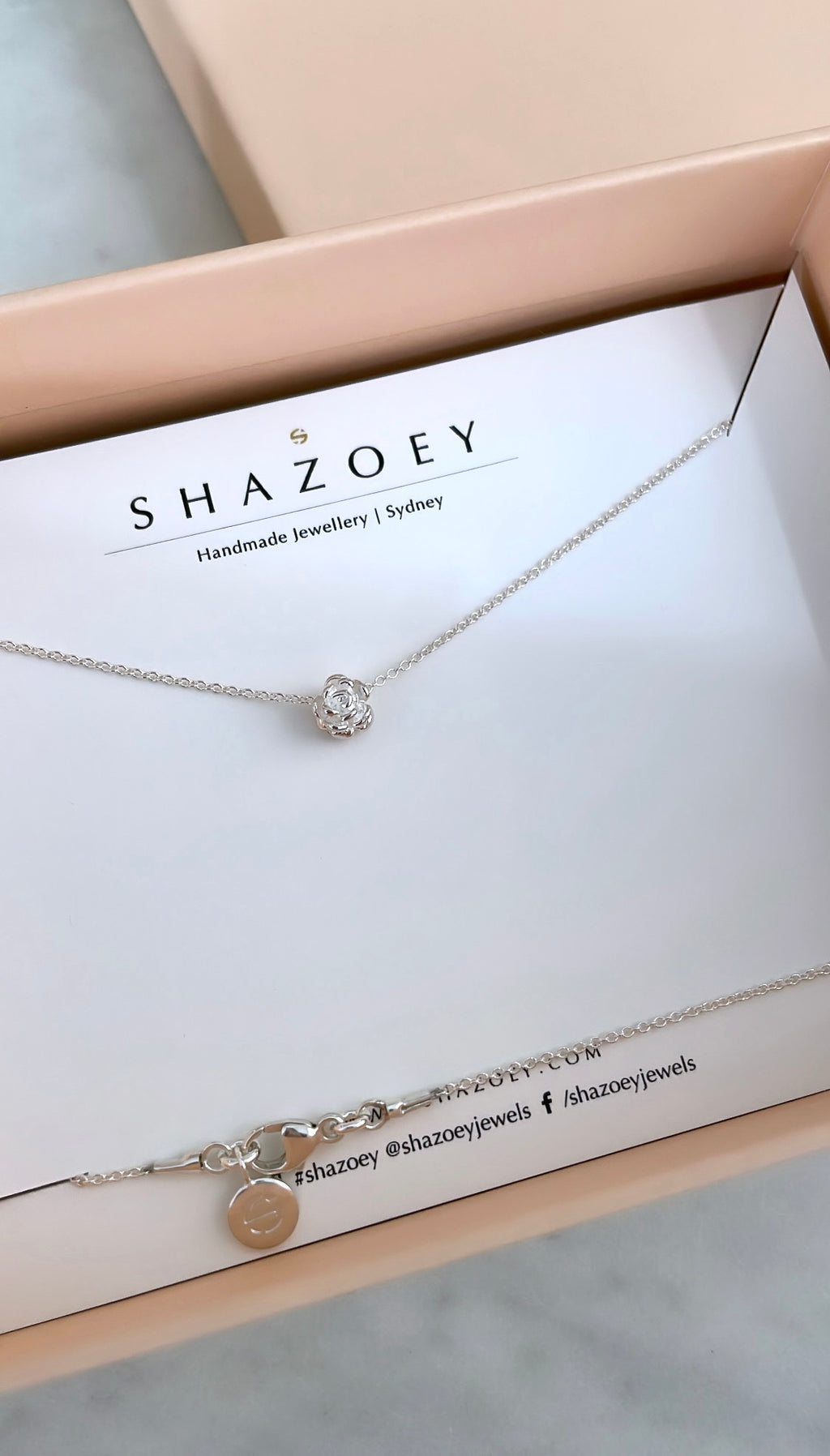 Silver flower pendant necklace on a Shazoey branded card and in gift box