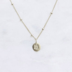 Personalised sterling silver initial necklace with custom letter pendant on a minimalist sterling silver dot chain