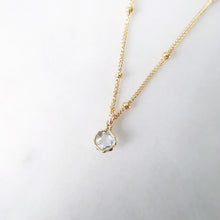 Aquamarine gemstone pendant on a gold satellite chain by SHAZOEY