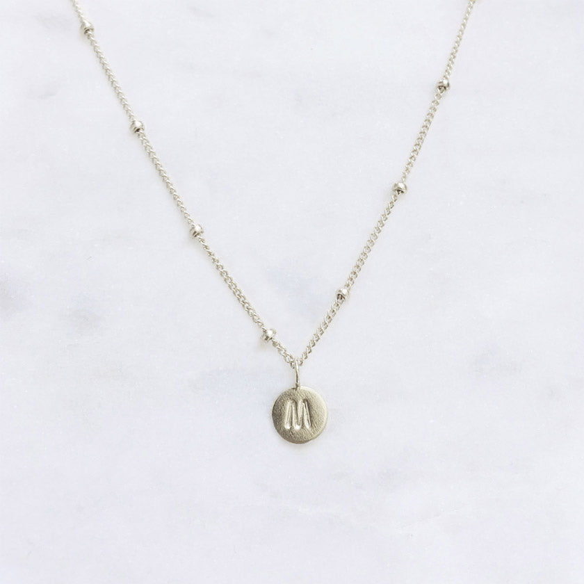 Dainty Sterling silver initial necklace with a personalised letter pendant and silver dot chain