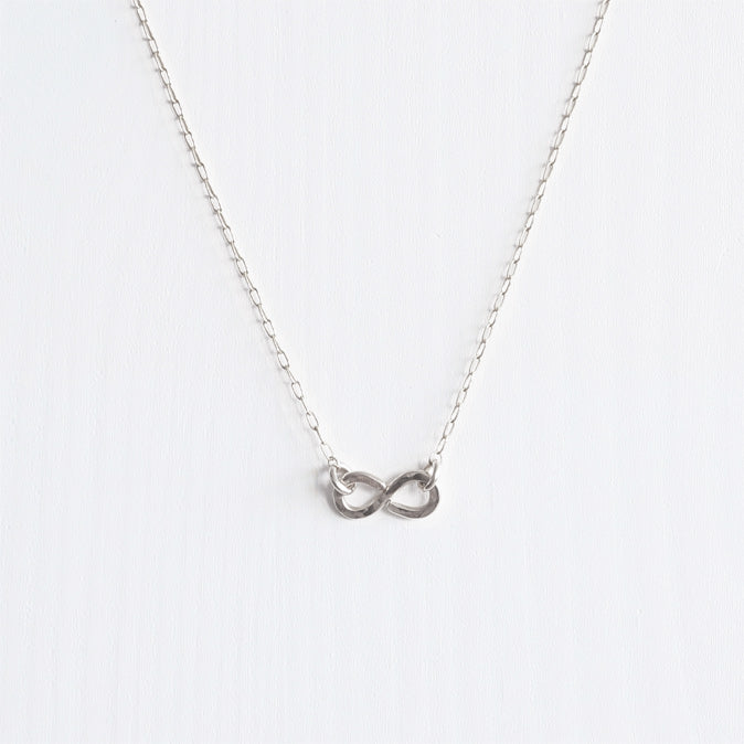 A delicate handmade sterling silver infinity necklace