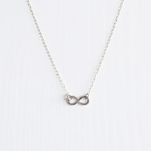 A delicate handmade sterling silver infinity necklace