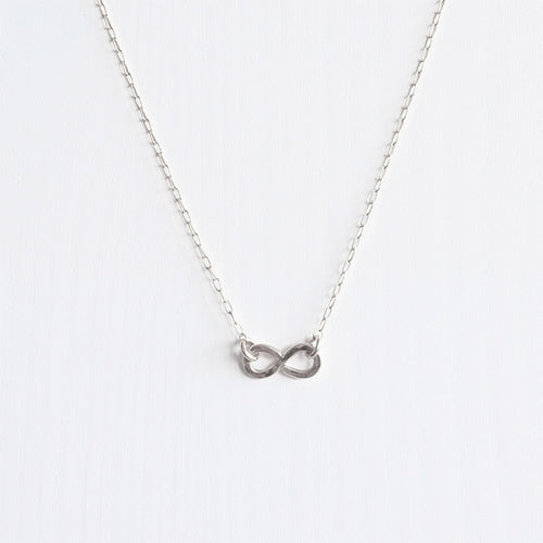 A delicate handmade sterling silver infinity necklace
