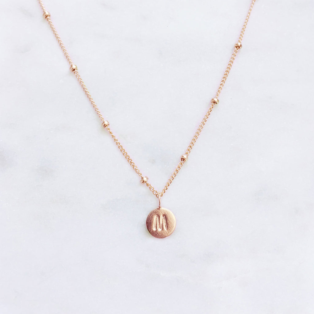 Rose gold initial necklace with a personalised hand stamped letter pendant, handmade jewellery in Australia
