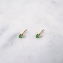 Dainty green emerald stud earrings set in gold