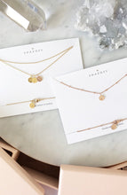 SHAZOEY personalised initial necklaces shown with their blush pink box packaging
