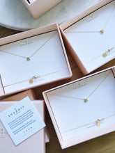 3 gold star necklaces in pink boxes ready for gifting