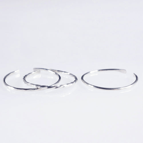 A set of 3 Sterling silver plain, hammered and twisted bands 