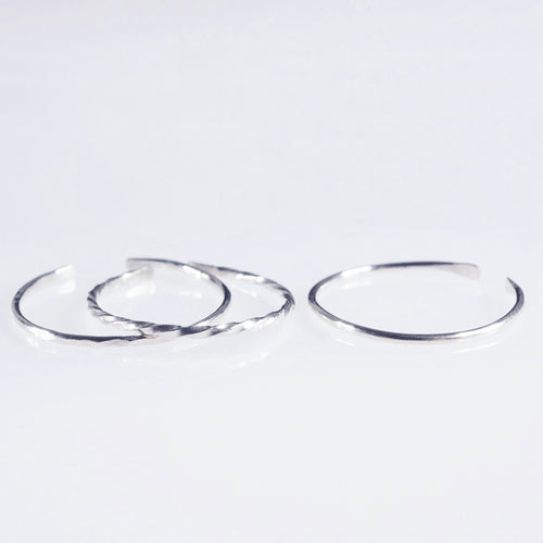 A set of 3 Sterling silver plain, hammered and twisted bands 