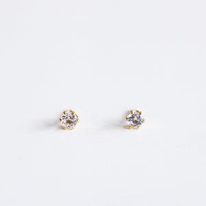 A pair of 3mm round white topaz gemstone studs in a 6 prong 14K gold filled settings